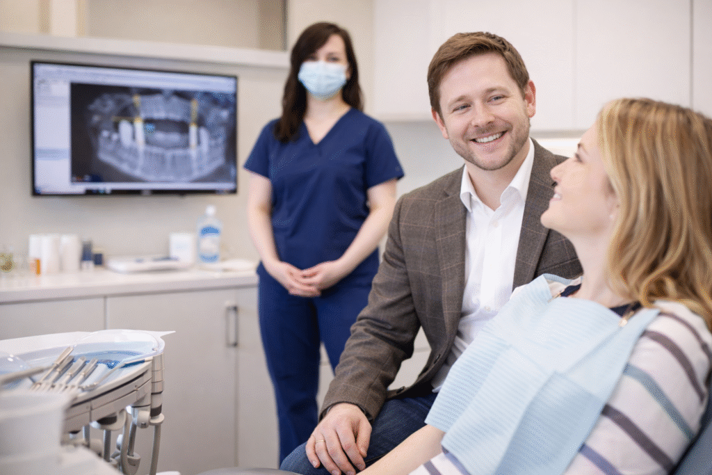 Dentist in St. Charles MO in a consultation with patient about dental implant surgery